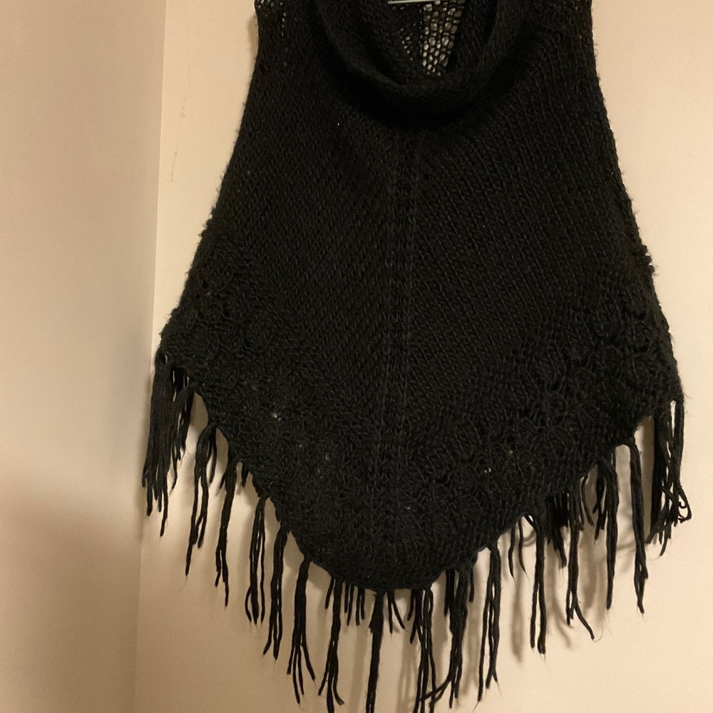 Lovely black knit poncho from Spain ..approximate size medium